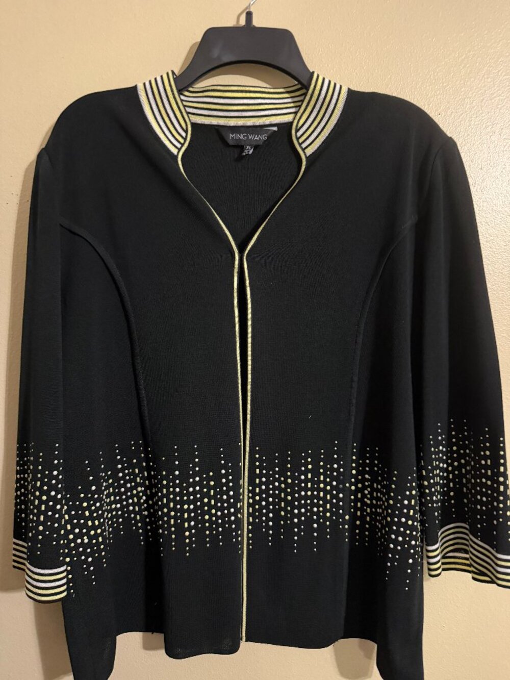 Black Jacket elegantly  accented in light yellow and white